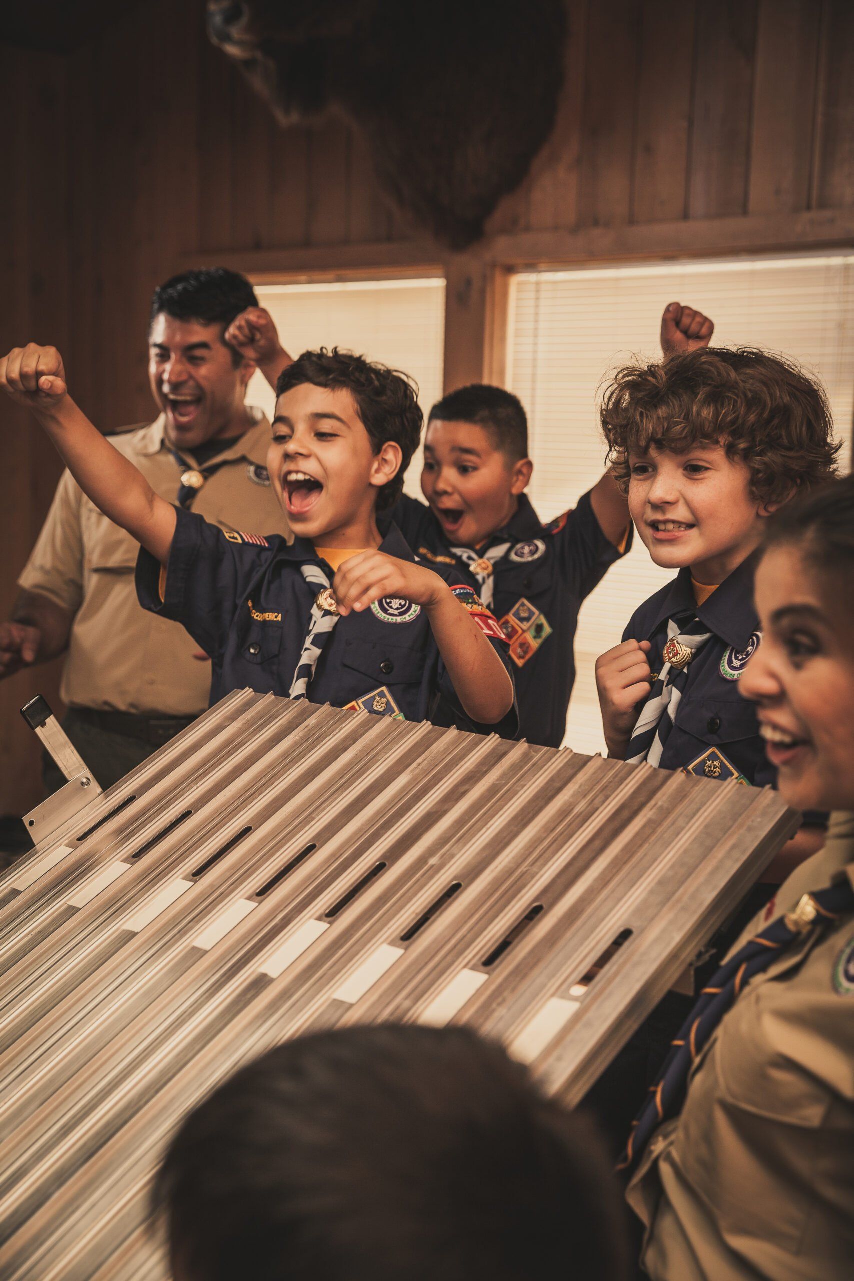 Cub Scouts racing Pinewood Derby Cars