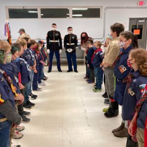 Marines inspecting Cub Scouts