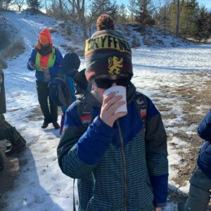 Cub Scout drinking cocoa