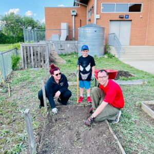 Cub Scouts cleaning garden beds